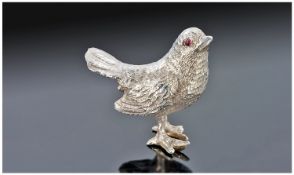 A Very Finely Detailed Miniature Silver Bird, possibly a wren. Free standing with pink gem set