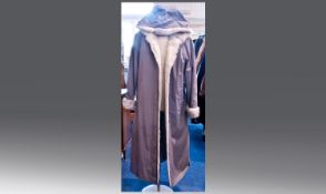 Ladies Light Grey Full Length Rain Coat with faux fur trims to the cuffs, lining and hood. Size 16