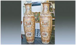 Two Large Oriental Vases, profusely decorated. Each showing 6 panels depicting various figures.