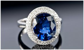 A 14k White Gold and Diamond Ring set with an oval cut blue sapphire approx. 5ct. Diamond approx 0.