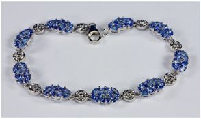 Tanzanite Bracelet, oval clusters of marquise cut stones, 6.6 carats of the rare, single source