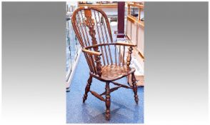 Mid 19th Century Ash and Elm Windsor Chair, With Spindle Supports And A Shaped And Pierced back