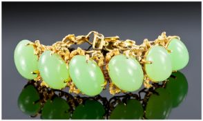 14k Gold Set Jade Bracelet. Set with six quality large cabochon cut jade stones. Marked 14k. Weight