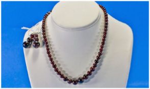 Deep Red Indian Garnet Necklace and Earrings, a graduated strand of round cut garnet beads fastened