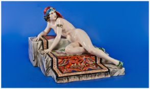 Italian, Vincenzo Bertolotti Milano Porcelain Figure Group Showing A Nude Maiden Laying On Three