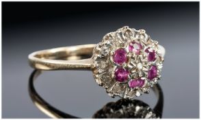 Ladies 9ct Gold Ruby and Diamond Cluster Ring, flower head setting. Fully hallmarked.
