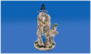 Chelsea Figure of a Chinaman Circa 1755.Seated on a flowering tree stump, gazing to the left, his