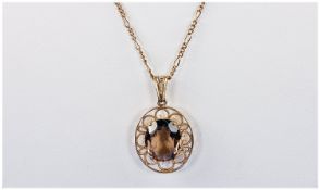 9ct Gold Set Smokey Topaz Pendant. Fitted on a 9ct gold chain. Fully marked. Chain length 22