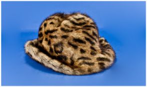 Ladies Ocelot Fur Hat, trilby style, curled brim, wider to the front, the crown with crease