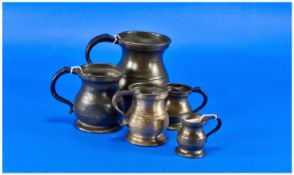 A 19th Century Set Of 5 Graduated Pewter Tankards, with bolus body shape. Height from 5 inches to 2