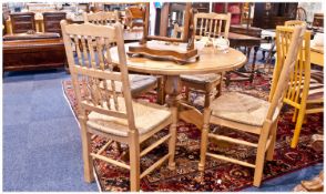 Pine Kitchen Table Of Circular Form Raised On A Pedestal Base, Complete With Four Matching Chairs,