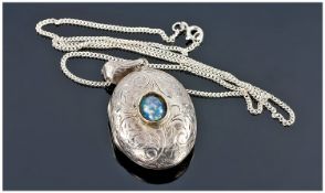 Oval Silver Locket Set With An Opal, Suspended On A Fine Link Silver Chain.