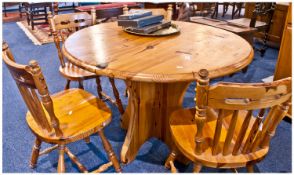 Pine Kitchen Table And Four Pine Spindle Back Chairs. Top 42 inch diameter, height 29 inches.