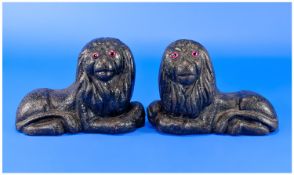 A Pair Of Victorian Cast Iron Door Stops Of Reclining Lions, with unusual glass eyes. Circa 1860. 7