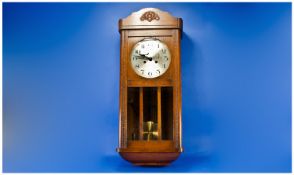 1930`s Box Oak Cased Wall Clock with round steel dial with German works. 8 Day movement. 30x12``.