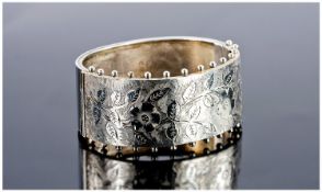 Victorian Ladies Silver Bangle, with engraved and chased decoration plus stud borders. Hallmark