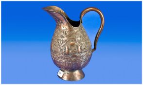 A Turkish Copper Embossed Jug, decorated with a floral design with central roundel`s. Traces of
