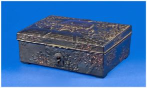 Japanese Metal Wood Lined Box. The hinged lid embossed with a Buddha seated on a shrine, the sides