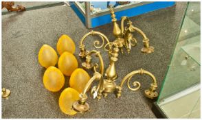 Pair of Brass 3 Branch Ceiling Lights with amber glass shades.