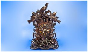 Black Forrest Impressive Cuckoo Carved Wooden Bracket Clock with figural cuckoo to top of clock. c.