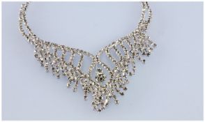 White Crystal Necklace and Earring Set, the central V shaped panel of the necklace is fixed