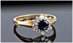 9ct Gold Dress Ring, Set With A Central Sapphire Surrounded By Round Brilliant Cut Diamonds, Fully