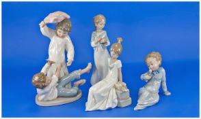 A Collection of Nao Figures by Lladro, 4 in total. Includes The Pillow Fight, height 9.75 inches