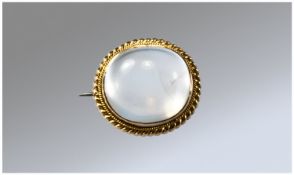 19thC Polished Moonstone Cabochon Brooch, Mounted In Yellow Gold With Rope Twist Edge, Unmarked. 18