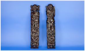 Pair Of Dutch 17th Century Carved Oak Carriards Of Fine Colour, Depicting two putti, one playing a