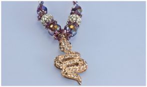 Crystal Snake and Purple Faceted Glass Pendant Necklace and Earrings, the snake pendant, with the