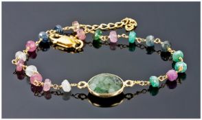 Emerald and Ruby Chain Bracelet, oval, faceted bezel set emerald to the centre with faceted