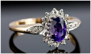 9ct Gold Set Diamond and Amethyst Ring. The single stone amethyst of good colour surrounded by 20