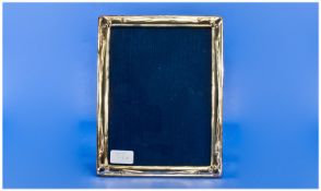 An Italian Sterling Silver Photo Frame of sinuous art Nouveau design with wood easel backing and