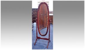 Oval Shaped Mahogany Cheval Mirror, turned supports on shaped cabriole type legs. Height 60 inches,