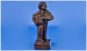 18cm High Copper Effect Cast Iron Statue Of Newspaper Boy. Signed `Speshul`.