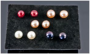 Five Pairs of Freshwater Pearl Stud Earrings, comprising peacock black, ivory white, lilac pink,