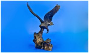 A Bronze Figure Of An Eagle Cast On A Rocky Sea Coast. Titled `Wings of glory` By Ronald Van