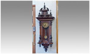 Victorian Carved Mahogany Cased Vienna Wall Clock with 8 day striking movement. Glass panels to