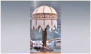 Art Nouveau Style Table Lamp Of Sinuous Design, Cast Metal Base Together With A Beaded Fringe
