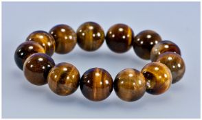 Tiger Eye Large Round Bead Bracelet, approximately 14mm wide round beads, all displaying