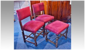 A Pair of Early Oak  Framed Chairs with Later 20th Century Upholstered Red Fabric Seats and back.