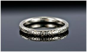 A Platinum Ring with Stylised Floral Decoration to the Exterior. Marked ``Platinum`` (950 purity)