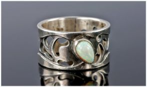 Silver Dress Ring Of Broad Pierced Form, The Front Set With A Polished Pear Shaped Opal, Fully