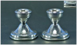 A Pair of Silver Squat Candlesticks. Hallmarked Birmingham 1921. Each 2.5 inches high.