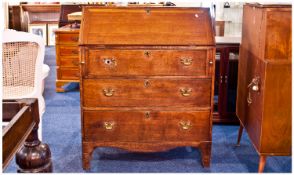 George III Oak Bureau, the fall revealing stationary departments with 3 long drawers below. 43.75