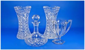 Four Pieces Of Glassware Comprising Ships Decanter with star cut base, pair of tall glass vases &