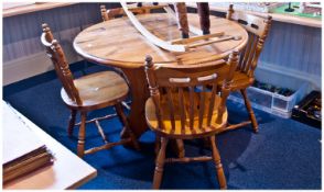Pine Kitchen Table And Four Pine Spindle Back Chairs. Top 42 inch diameter, height 29 inches.