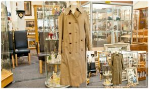 Two Aquascutum Designer Ladies Trench Coats, water and stain repellant, one olive green, one beige.