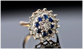 Ladies 9 Carat Gold Set Diamond and Sapphire Cluster Ring, flower head setting. Fully marked.