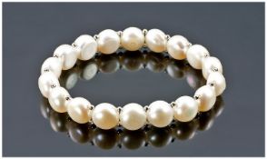 Ivory White Cultured Pearl Bracelet, a single row of large, 10-11mm button pearls, separated by